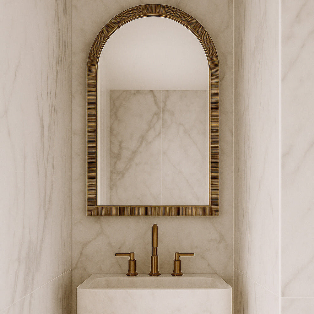 Bathroom with marble wall, sink, and Rattan Arched Mirror.