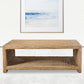 Rectangular Coastal Coffee Table in Coastal Living Room with wave painting.