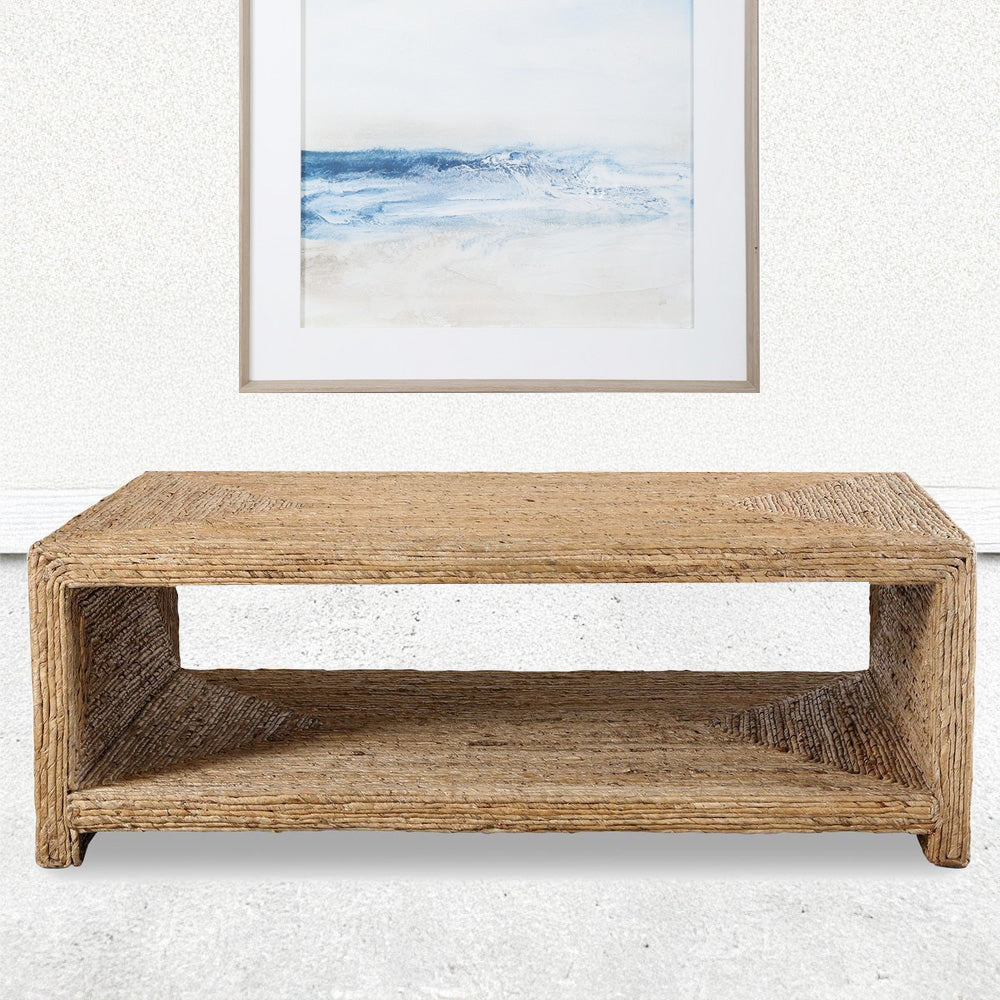 Rectangular Coastal Coffee Table in Coastal Living Room with wave painting.