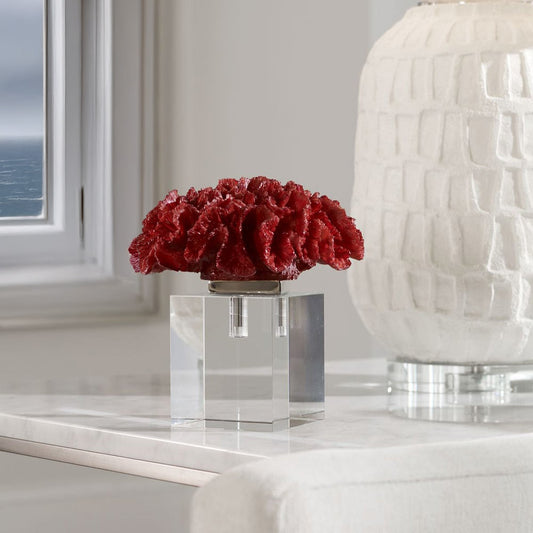 Red coral statue in coastal white living room. 