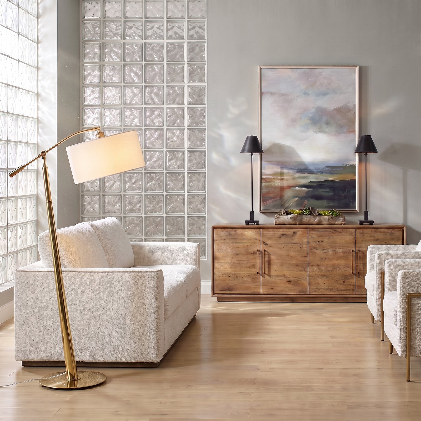 White glass block living room with white sofa and coastal floor lamp;.