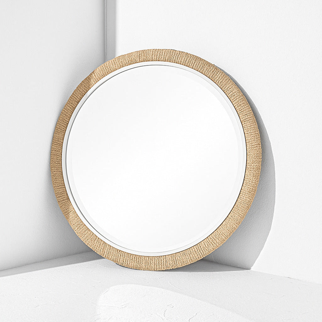 Round mirror with a wooden frame on a white background