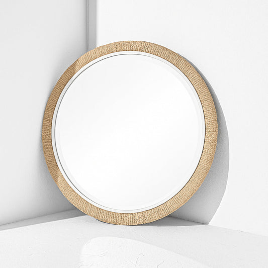 Round mirror with a wooden frame on a white background