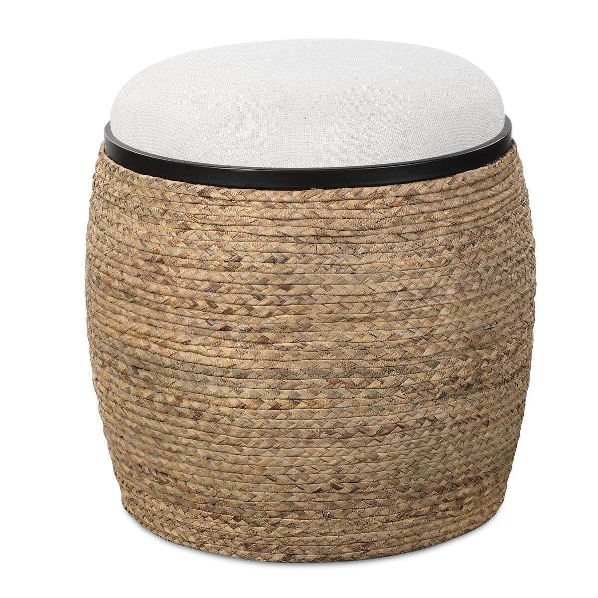 Woven stool with a white cushion on a white background