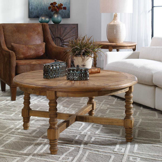 Wooden round table with turned legs on a white background
