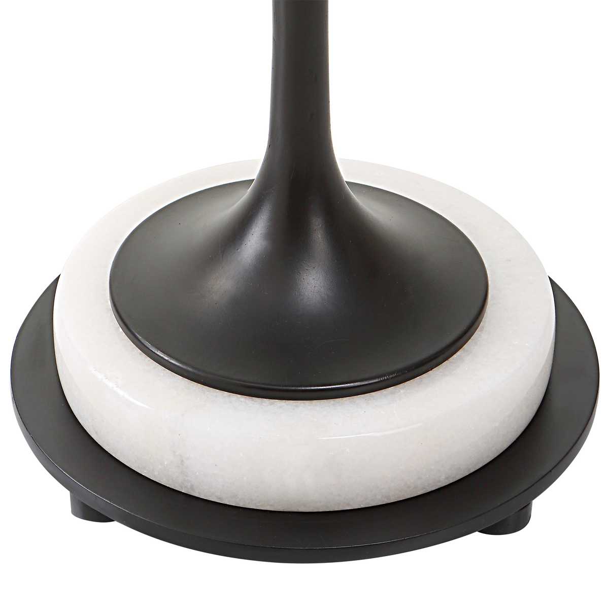 Close-up of a black and white lamp base on a white background
