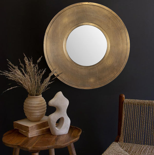 Round Gold Mirror 30 Inches in diameter in a living room.