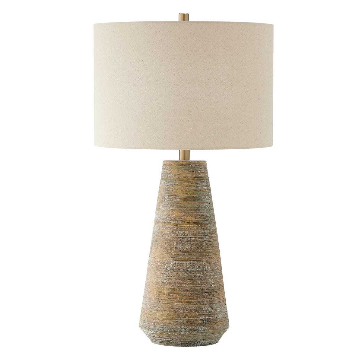 Table lamp with textured ceramic base and beige fabric shade on a white background