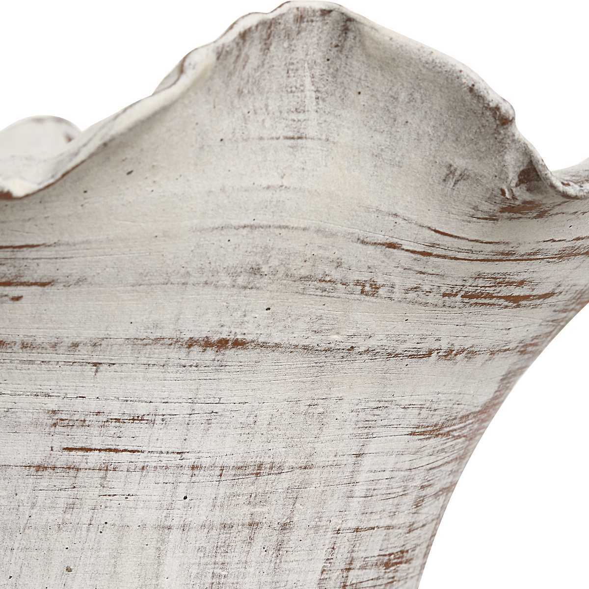 Close-up of a textured white surface with brown accents