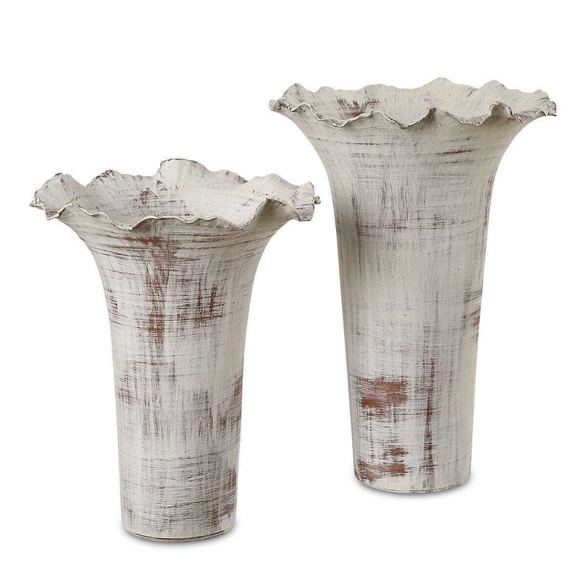 Two decorative vases with ruffled edges on a white background