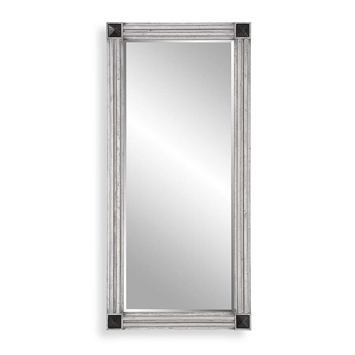 Rectangular mirror with decorative silver frame on a white background