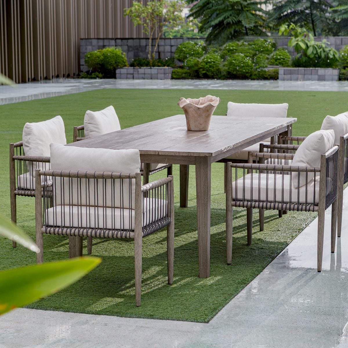 Outdoor gray dining table with chairs.