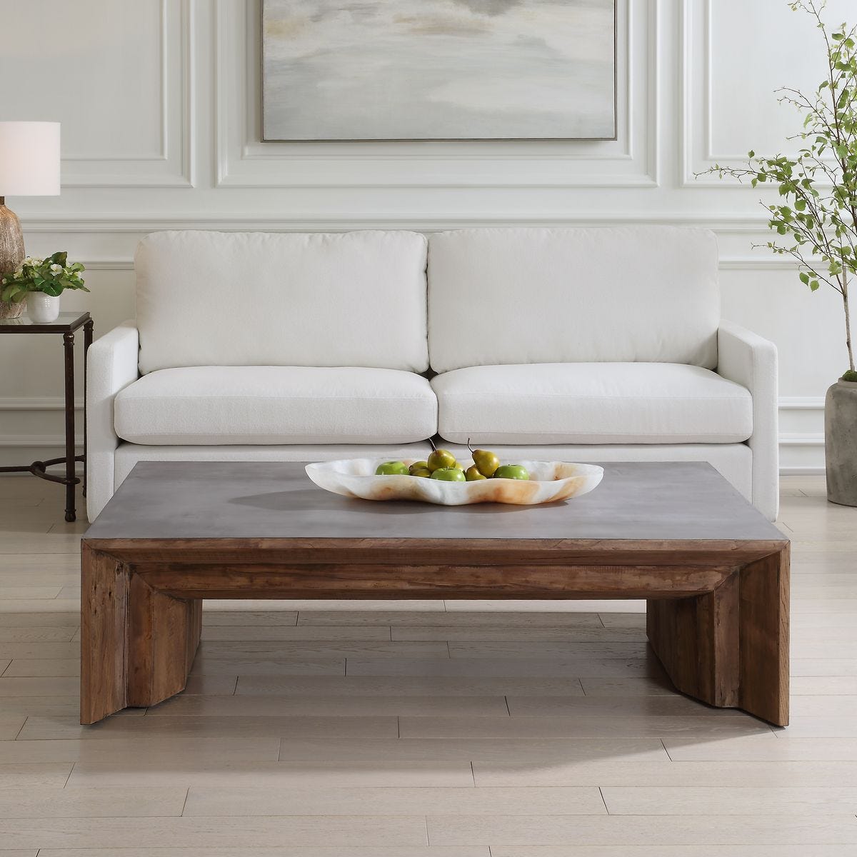 Living room with a white sofa and wooden coffee table.