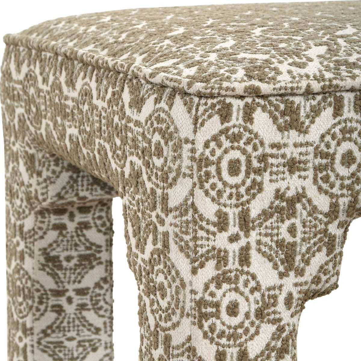 Green and white ottoman with Moroccan texture and pattern.