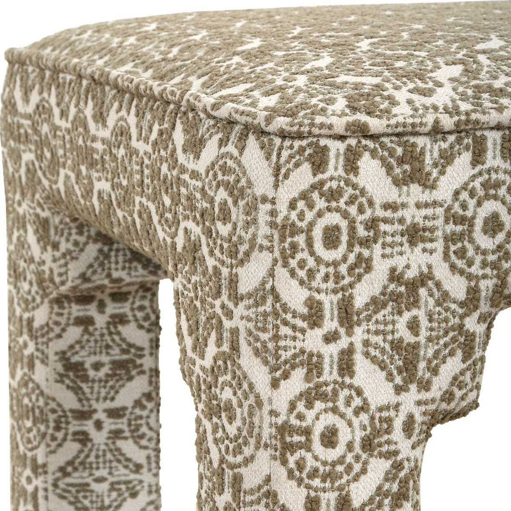 Green and white ottoman with Moroccan texture and pattern.