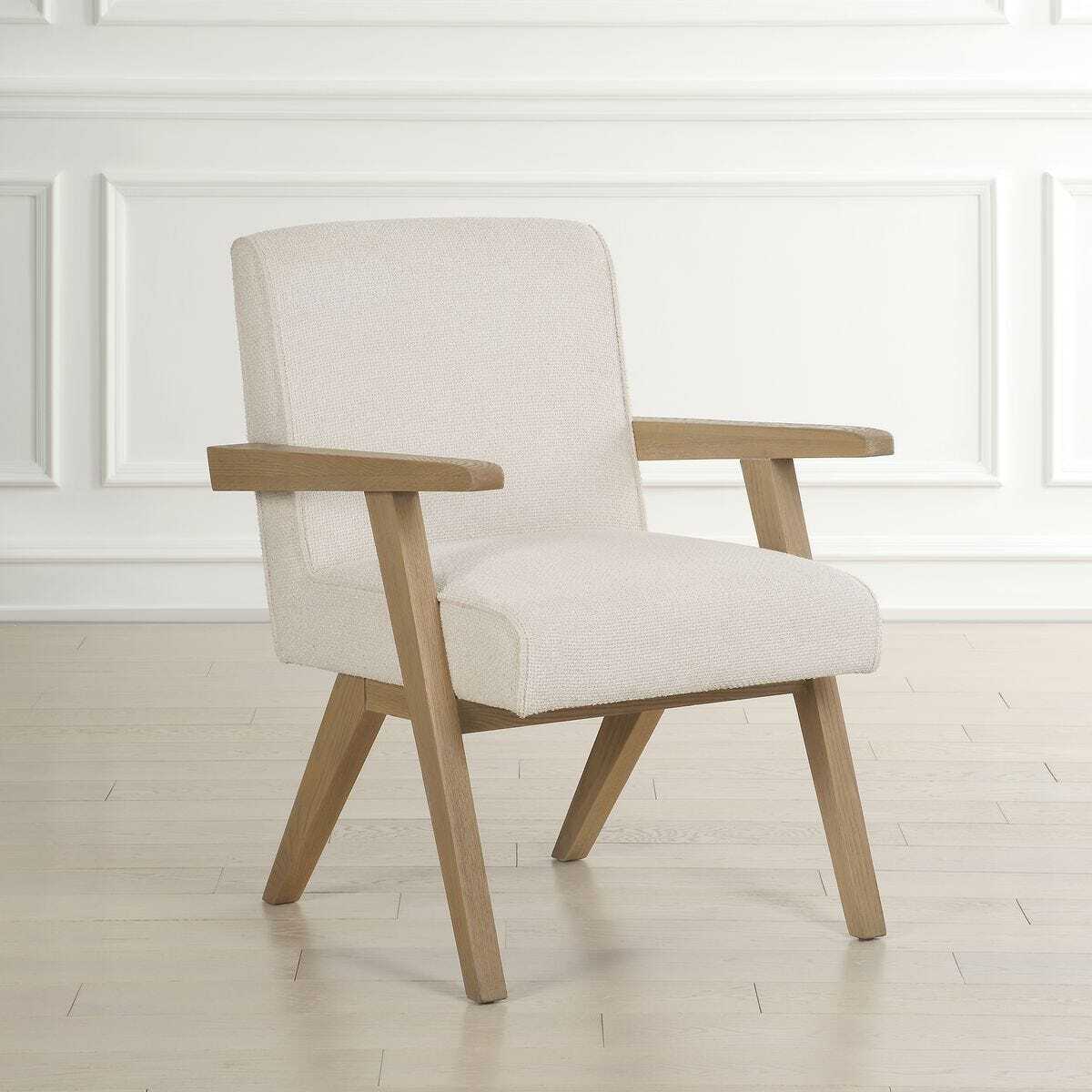 Beige armchair with wooden frame on a light wooden floor