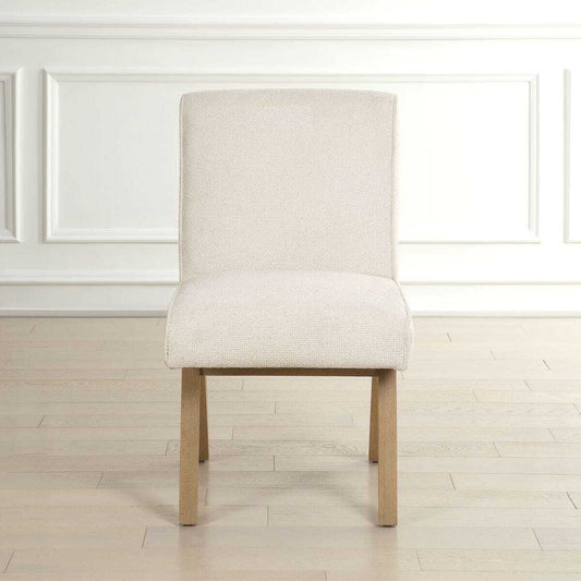 Beige upholstered chair with wooden legs on a white background