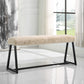 White sherpa bench with metal frame in a modern white living room with abstract abstract art.