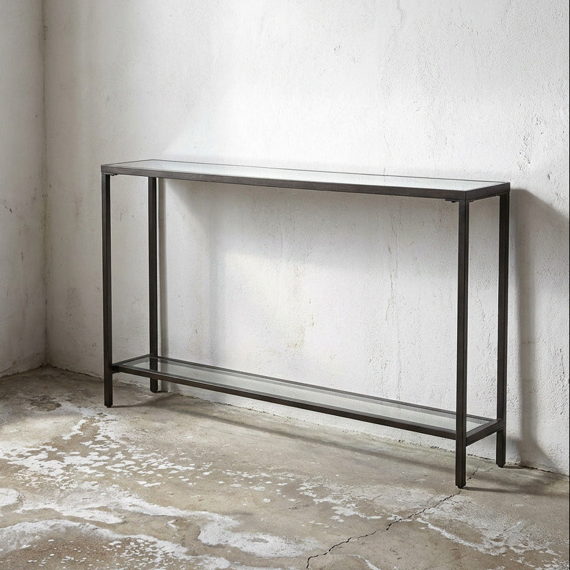 Slim Black Console table in a minimalistic room with concrete floor and walls