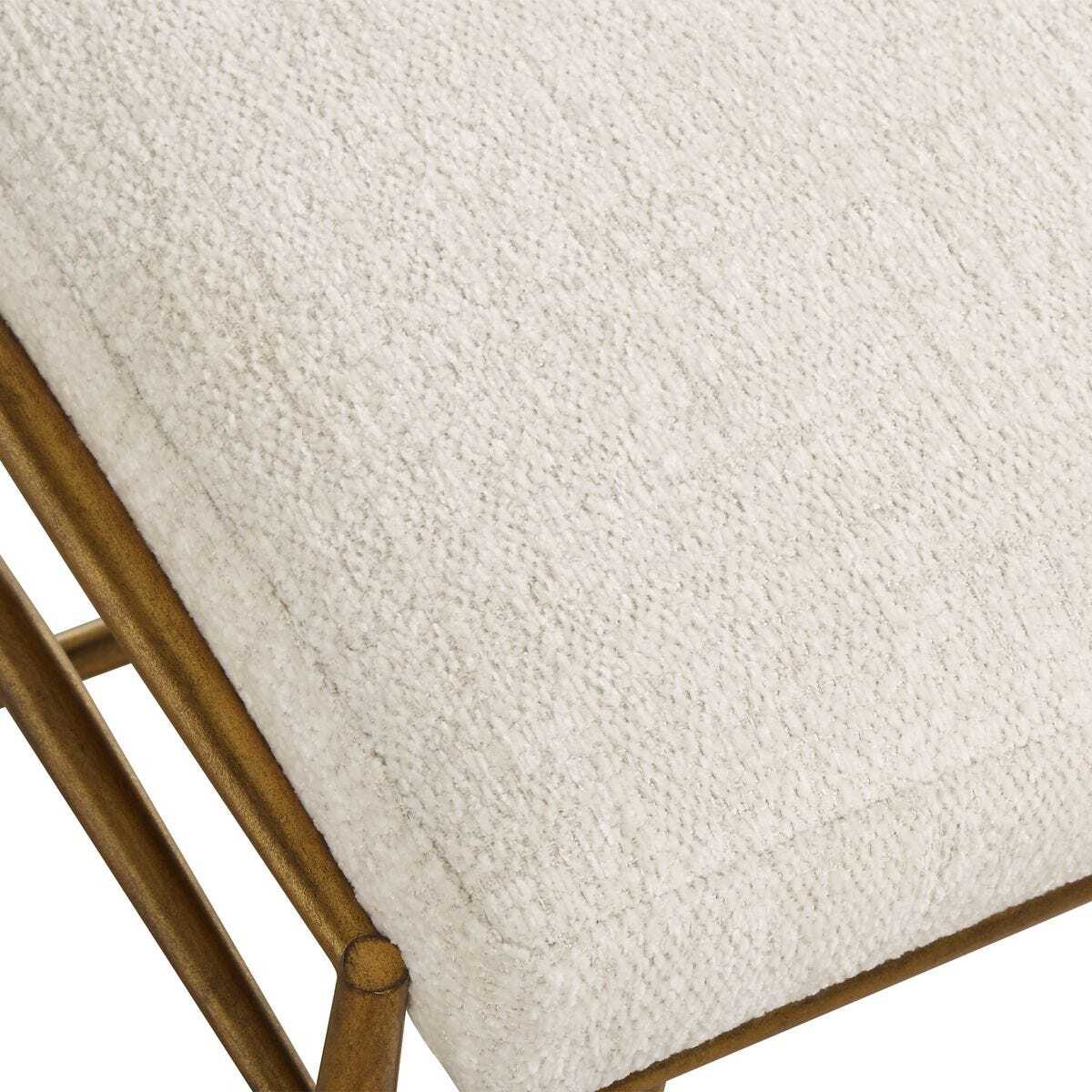 Close-up of a textured white cushion on a wooden chair