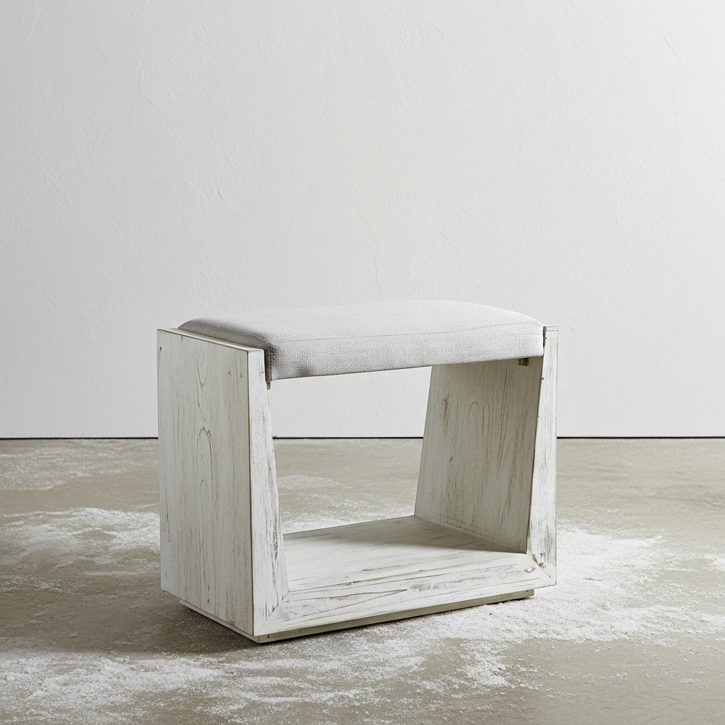 Small white bench seat in warehouse.