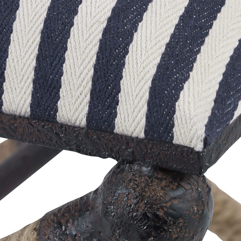 Close-up of a chair with striped cushion and metal base
