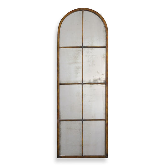 Three arched mirrors with a vase of flowers on a console table against a white wall.