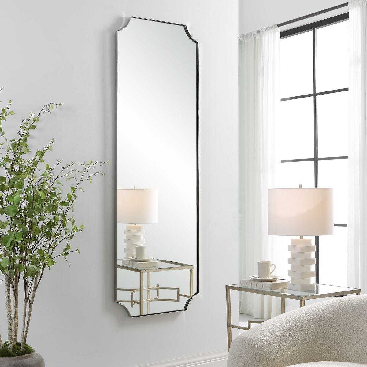 Angled long polished nickel mirror.