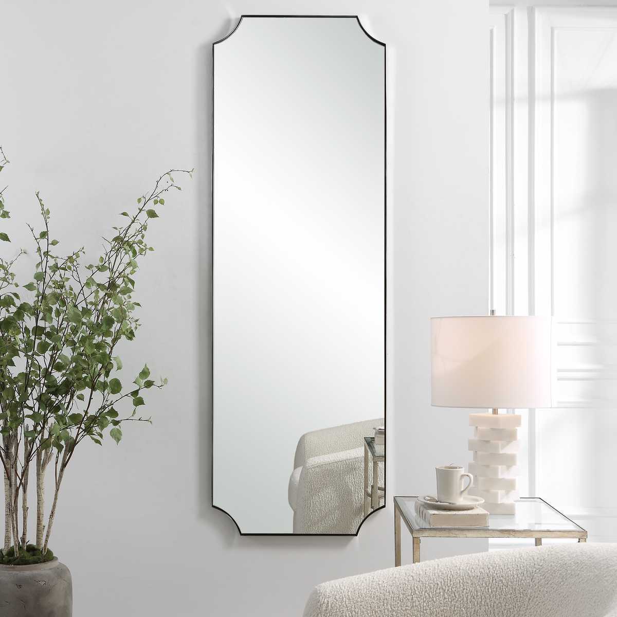 Long scalloped rounded polished nickel mirror.