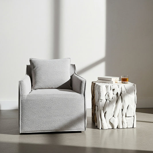 Gray armchair with a cushion on a white background