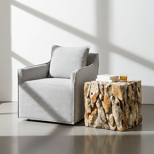 Wooden cube stool with a natural, textured surface in a minimalistic setting.