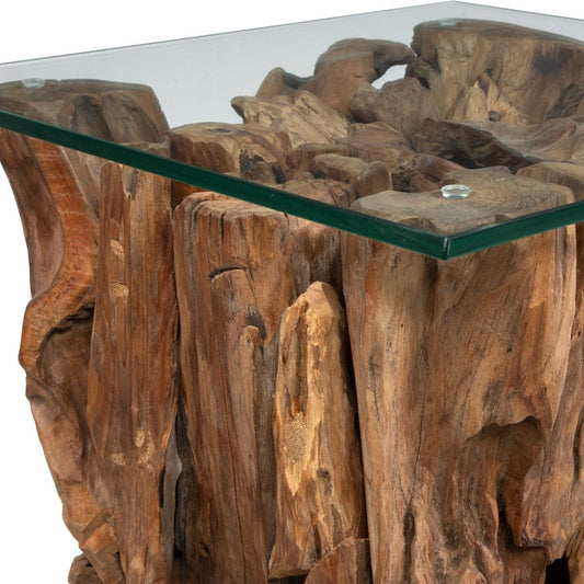 Decorative side table with natural wood base and glass top in a living room setting.