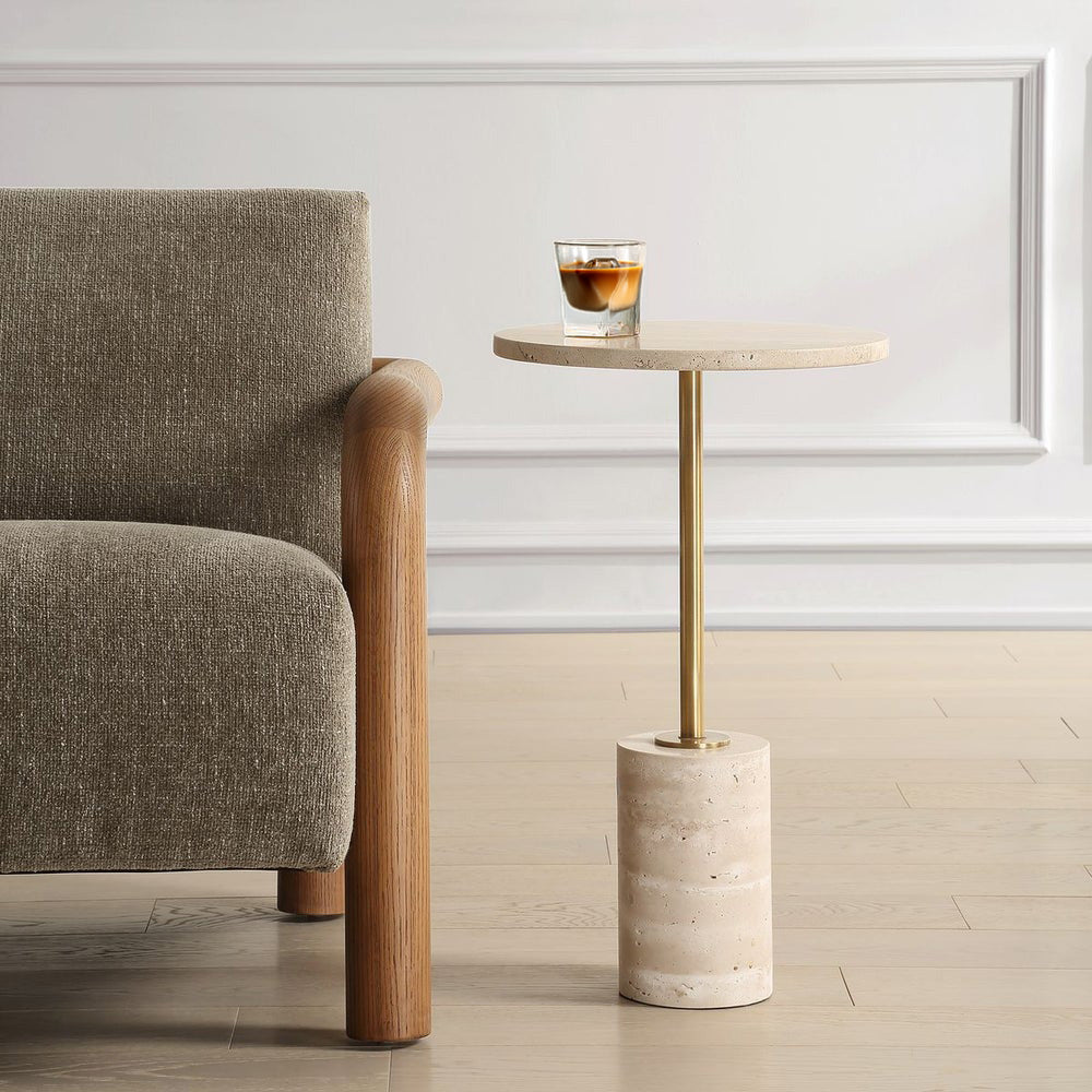 Travertine accent table with iced latter in a living room with a brown decorative chair.