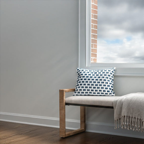 Coastal Hallway Bench in a Beach Condo under a window with Blue and White Pillow. 