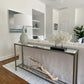 Coastal Living Room with Slender Silver Console Table with Decorative Coral and Driftwood Sculpture.