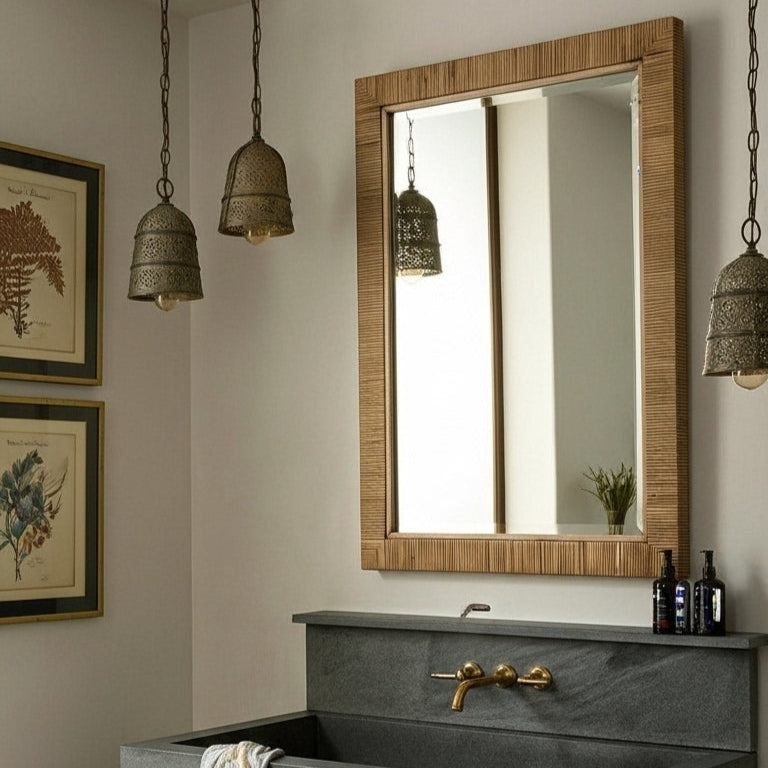 Bathroom vanity with a large mirror, sink, and decorative elements.
