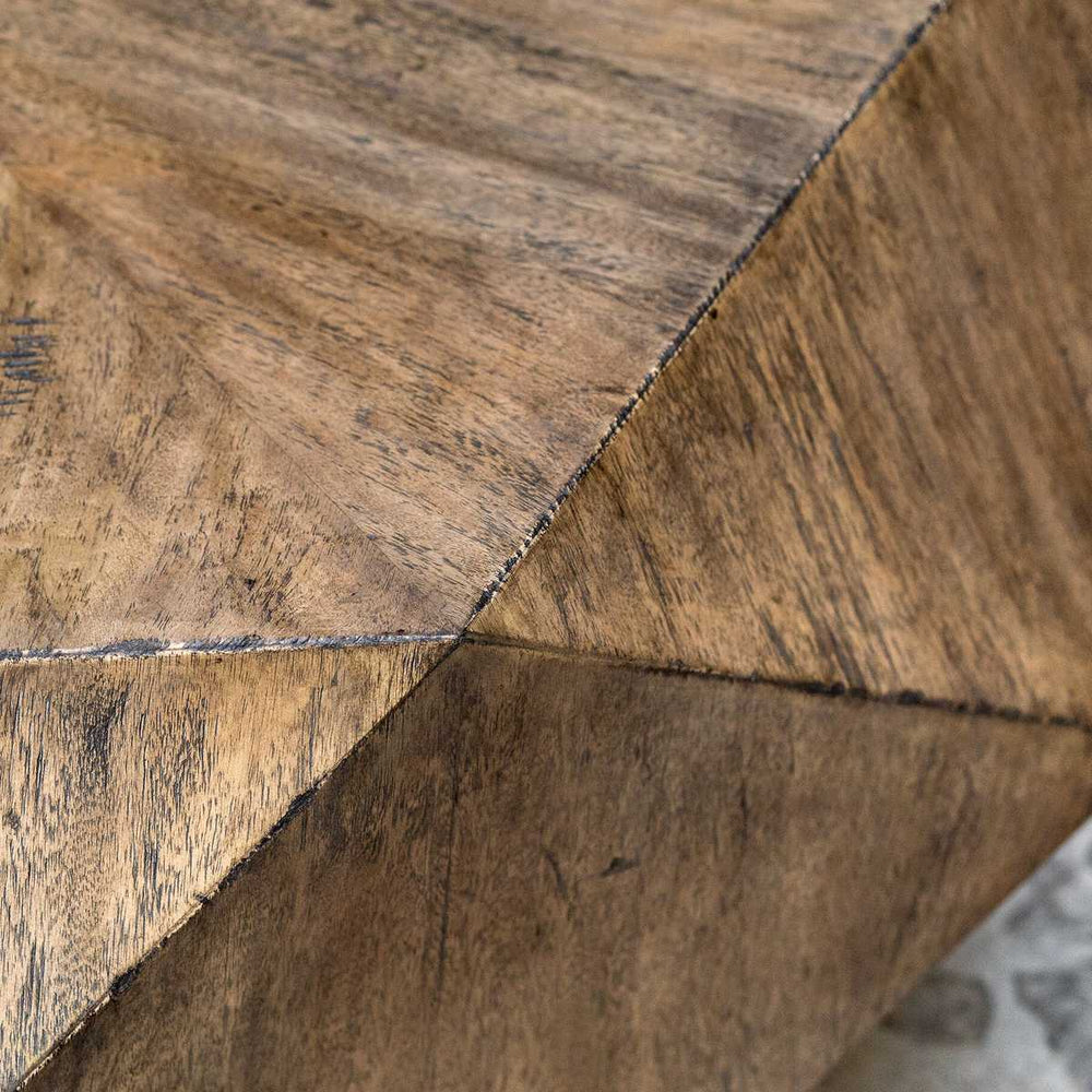 Close-up of a burnished honey wood surface with a geometric pattern