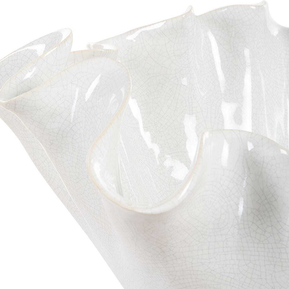 Close-up of a white ceramic bowl with a textured surface on a white background