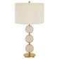 White and brass table lamp on white background.