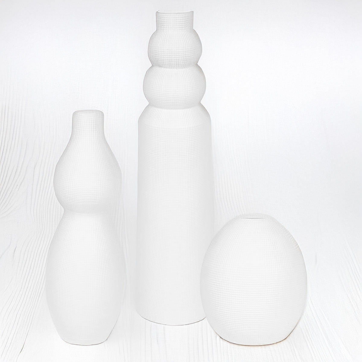 White Ceramic Vases against a white background.