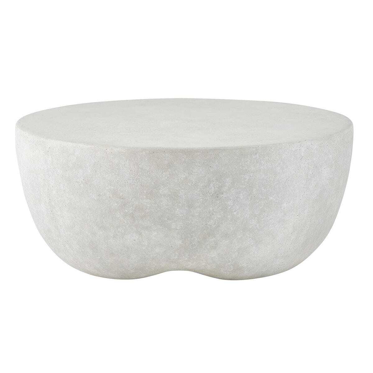 A modern, organic-shaped round coffee table made of textured light gray stone or concrete, shown against a plain white background.