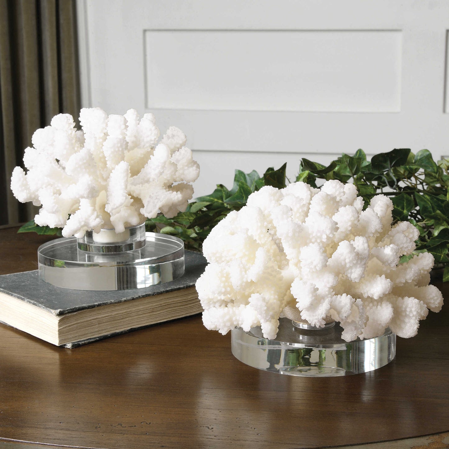 White coral sculptures on desk.