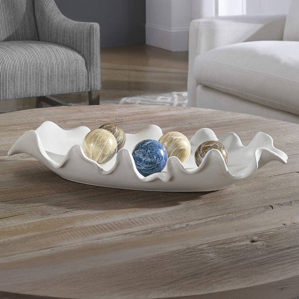 White decorative tray with wood coffee table in a farmhouse modern living room.