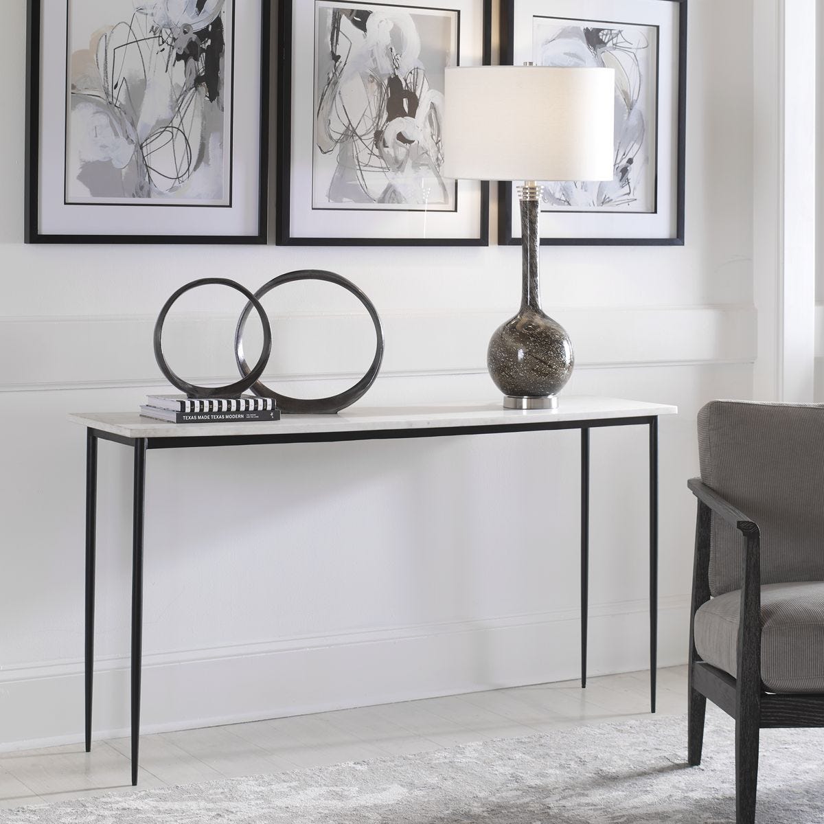 Modern console table with decorative items in a living room setting