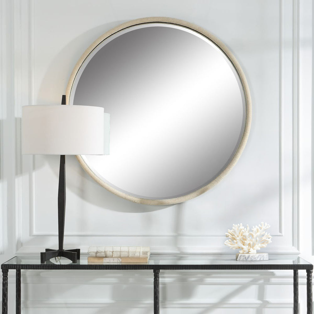 Circular white rope mirror.