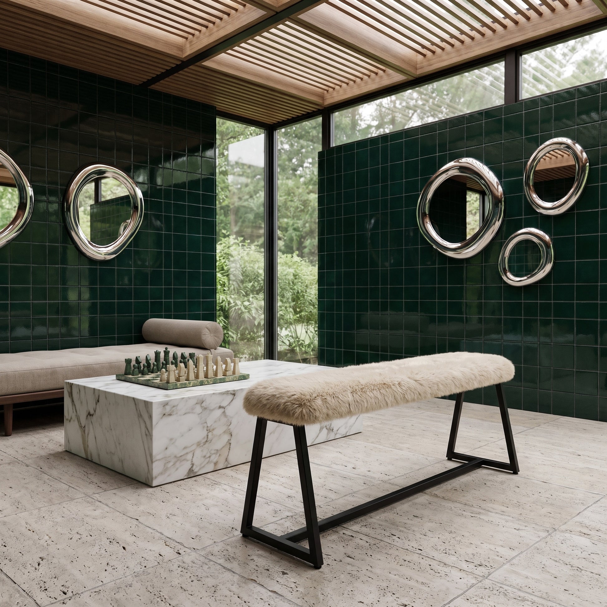 A modern interior scene with a long bench featuring a cream sheepskin or faux-fur seat and black metal legs, placed in front of a marble coffee table and dark green tiled walls with round chrome mirrors.