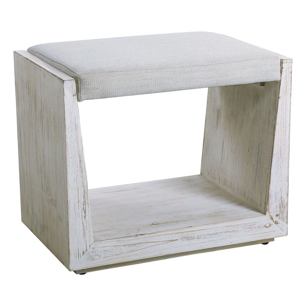 Small white bench with a textured white cushion on a white background