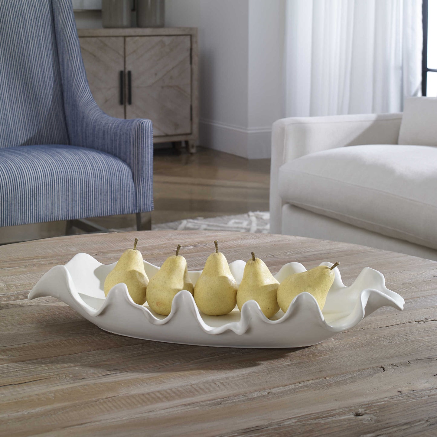 White Tray on Coffee Table holding Fruit. 