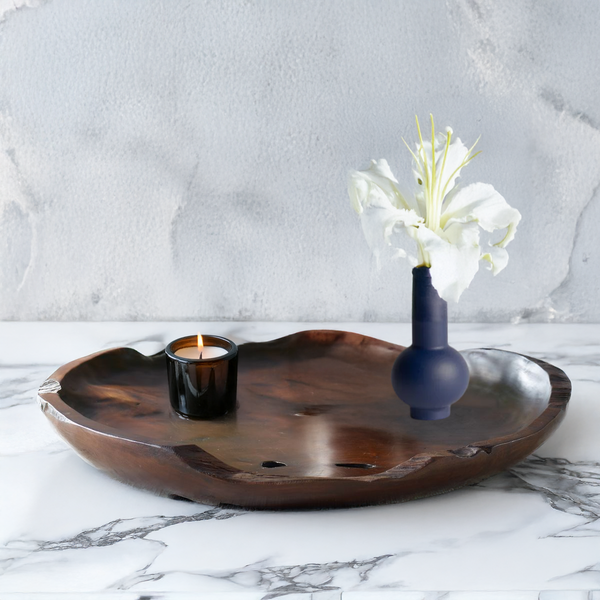 A round, teak wooden serving tray.
