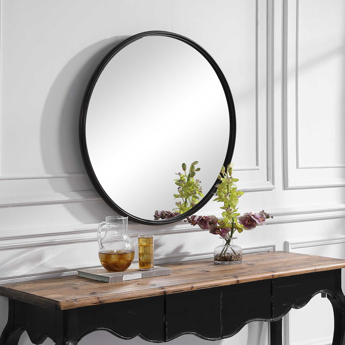 Aged black round mirror